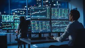Two men reviewing investment data